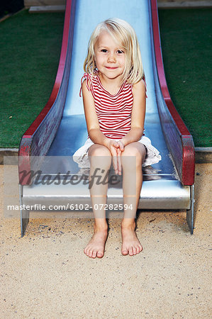 Girl on playground slide, Sweden
