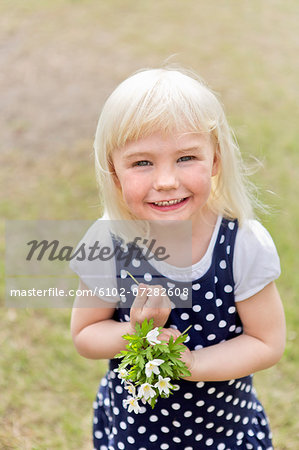 Happy girl with flowers