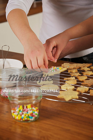 Children decorating Christmas cookies, Munich, Bavaria, Germany