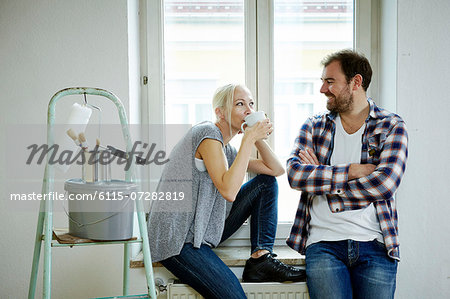 Home improvement, couple  taking a coffee break, Munich, Bavaria, Germany