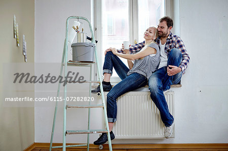 Home improvement, happy couple taking a break, Munich, Bavaria, Germany