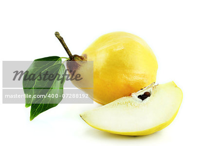 sweet quinces with leaves and slice on white