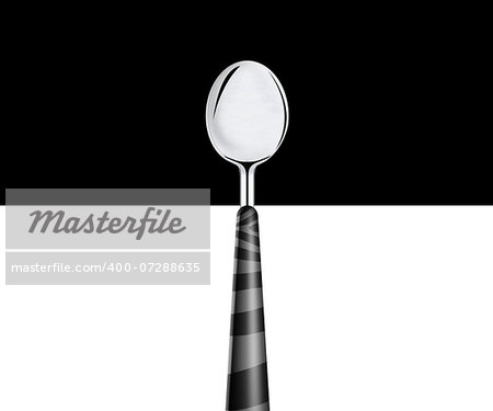 metal spoon on white and black background