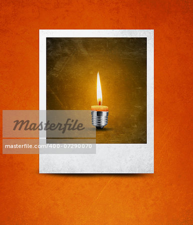 wax candle into lighting bulb in photograph, light bulb conceptual Image.