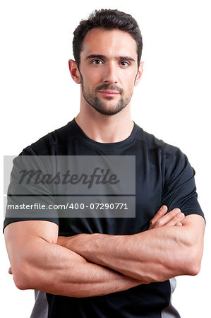 Personal trainer with is arms crossed, isolated in white
