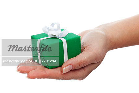 Small gift box in woman hand - christmas present, isolated