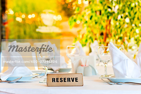 beautifully laid for supper table with a sign reserved