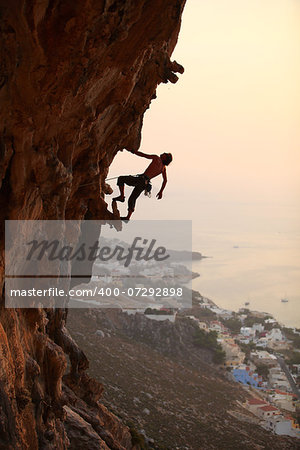 Rock climber at sunset, Kalymnos Island, Greece