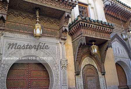 Ornate entrance to the historic Kairaouin Mosque deep inside the medina of Fes in Morocco.