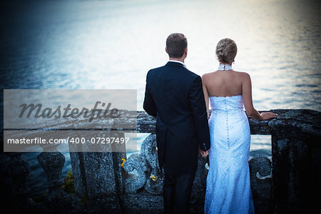 Young newly wed couple in a landscape