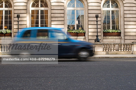 Vintage Taxi in motion in London.
