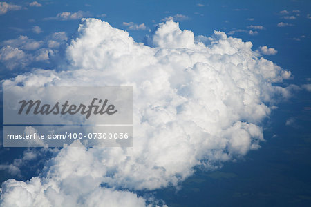 Blue and silver clouds background, view from airplane