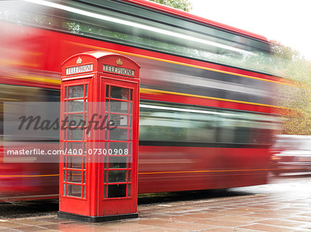 Red Phone cabine and bus in London.  Vintage phone cabine monumental