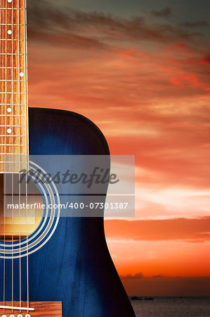 blue classic acoustic guitar, on nature background