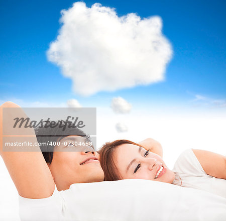 couple sleeping on the bed with dream cloud concept