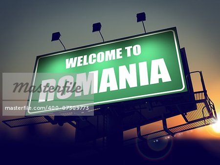 Welcome to Romania - Green Billboard on the Rising Sun Background.