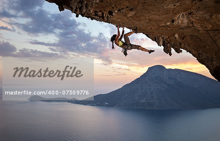 Young female rock climber at sunset, Kalymnos Island, Greece