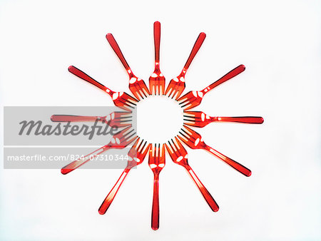 Red Plastic Forks Arranged In A Circle
