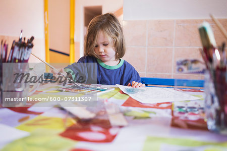 Portrait of Girl Painting in Classroom