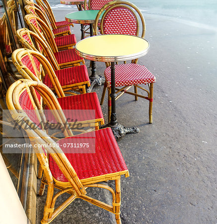 Street view of a coffee terrace with tables and chairs,paris France