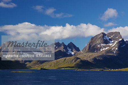 Dramatic mountain peaks of Lofoten islands in Norway with fjords and small fishing villages along the coast