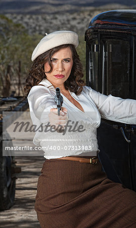 1920s vintage gangster woman aiming pistol