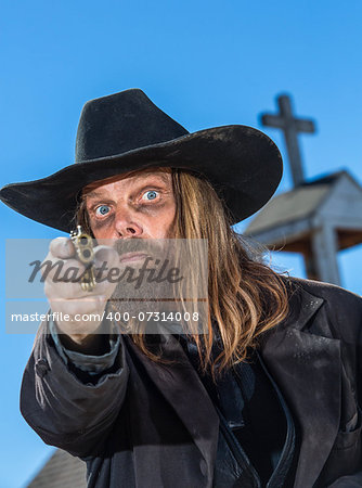 A Bandit Points Gun At Camera