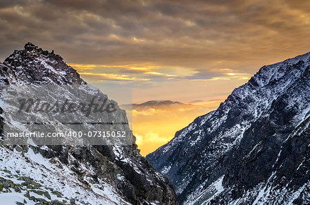 Winter mountains at sunset with colorful clouds and sky, High Tatras, Slovakia