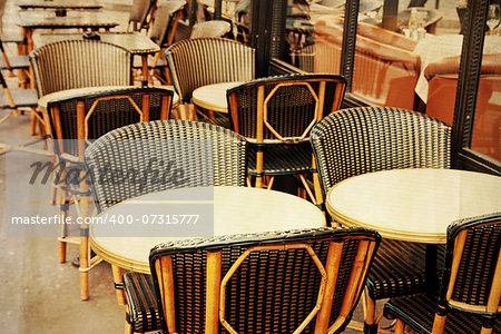 old-fashioned coffee terrace with tables and chairs,paris France