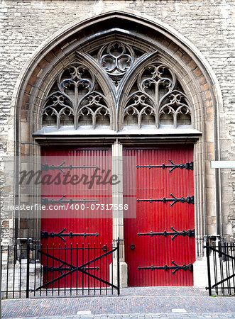 Red church door of the Zuiderkerk in Leiden, the Netherlands