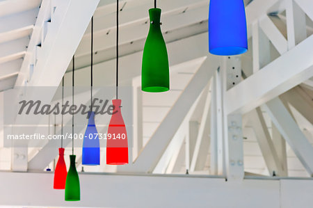 decorative colored lanterns under a white wooden ceiling beach bar