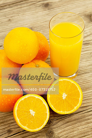 fresh and  healthy tasty orange juice on wooden background