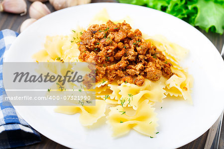 Delicious bow tie pasta Bolognese on a plate