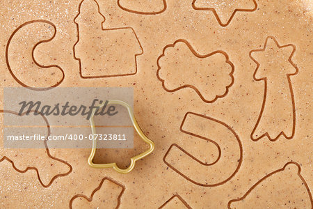 Gingerbread dough for christmas cookies with cookie cutter