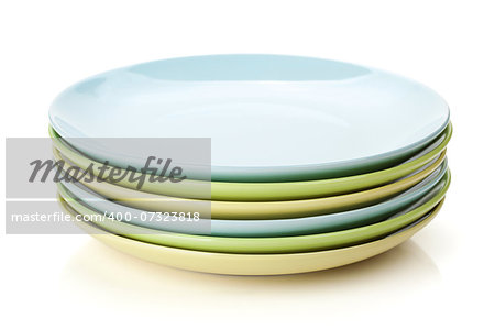 Colorful plates and saucers. Isolated on white background
