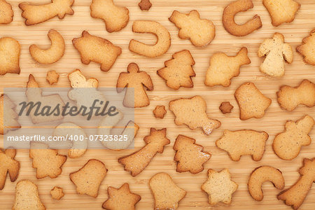 Various gingerbread cookies on wooden table background