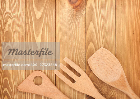Kitchen utensils on wooden table background. View from above with copy space