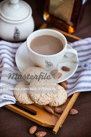 Almond cookies and cup of coffee on the tray