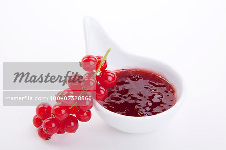 tasty fresh red currant jam isolated on white background