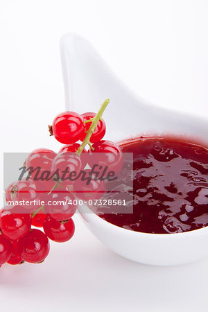 tasty fresh red currant jam isolated on white background