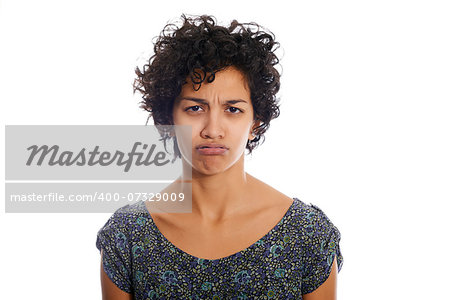 portrait of hispanic woman looking at camera upset and sad. Isolated on white background