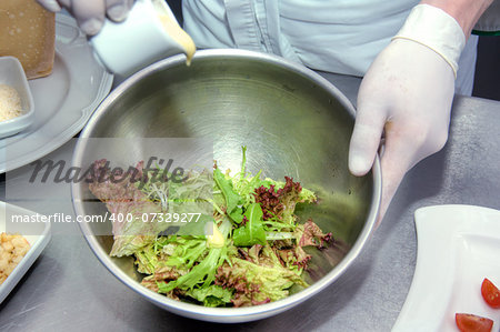 Chef chopping food ingredients on the kitchen.