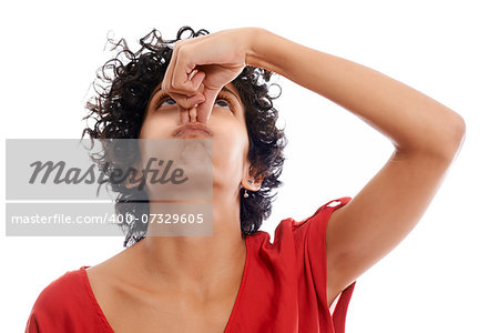 hispanic woman holding breath closing nose with fingers on white background