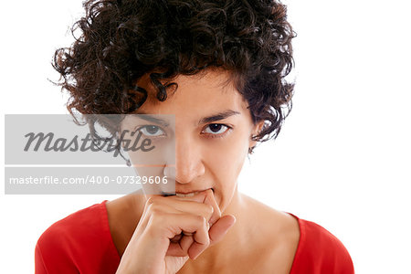 hispanic frustrated woman biting fingers, angry, looking at camera