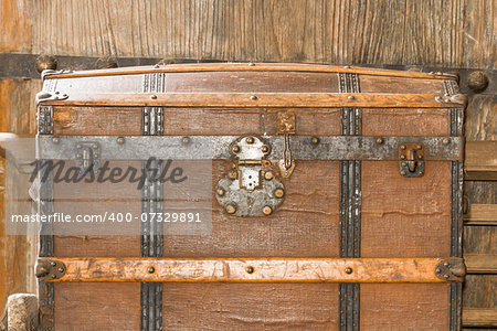 Detail of the lock of an old metal chest.