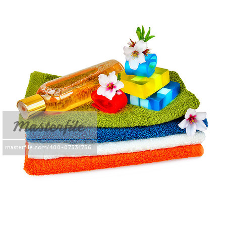 Towels, body care, natural soap and almond flowers. Composition for health and hygiene.