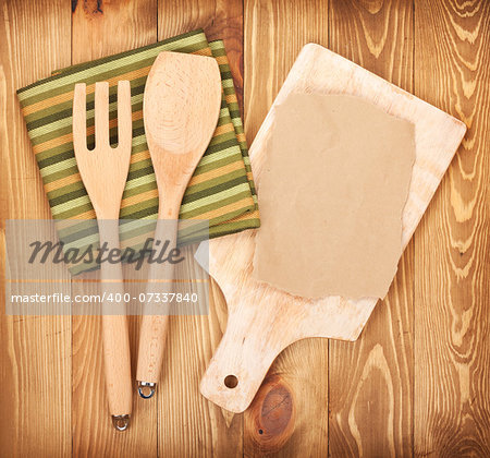 Kitchen utensils on wooden table background. View from above with copy space