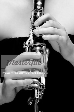 Hands of Young Female Musician Playing Clarinet