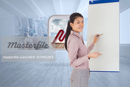 Businesswoman painting on an easel against city scene in a room