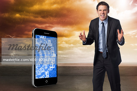 Stressed businessman gesturing against balcony and stormy sky